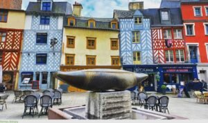 American buyer exploring historic French city streets while researching property opportunities in France.