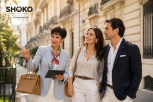 Spanish property buyer exploring an elegant Paris Haussmann neighborhood street with a local advisor